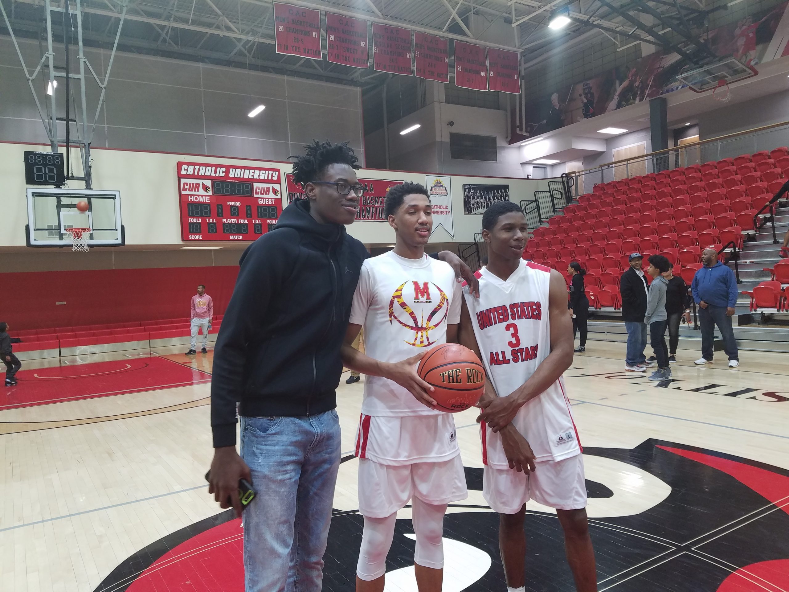 Andrew Wiggins, center, poses with fellow Maryland basketball recruits Jalen Smith, left, and Serrel Smith right, following Friday night’s Capital Classic at Catholic University
